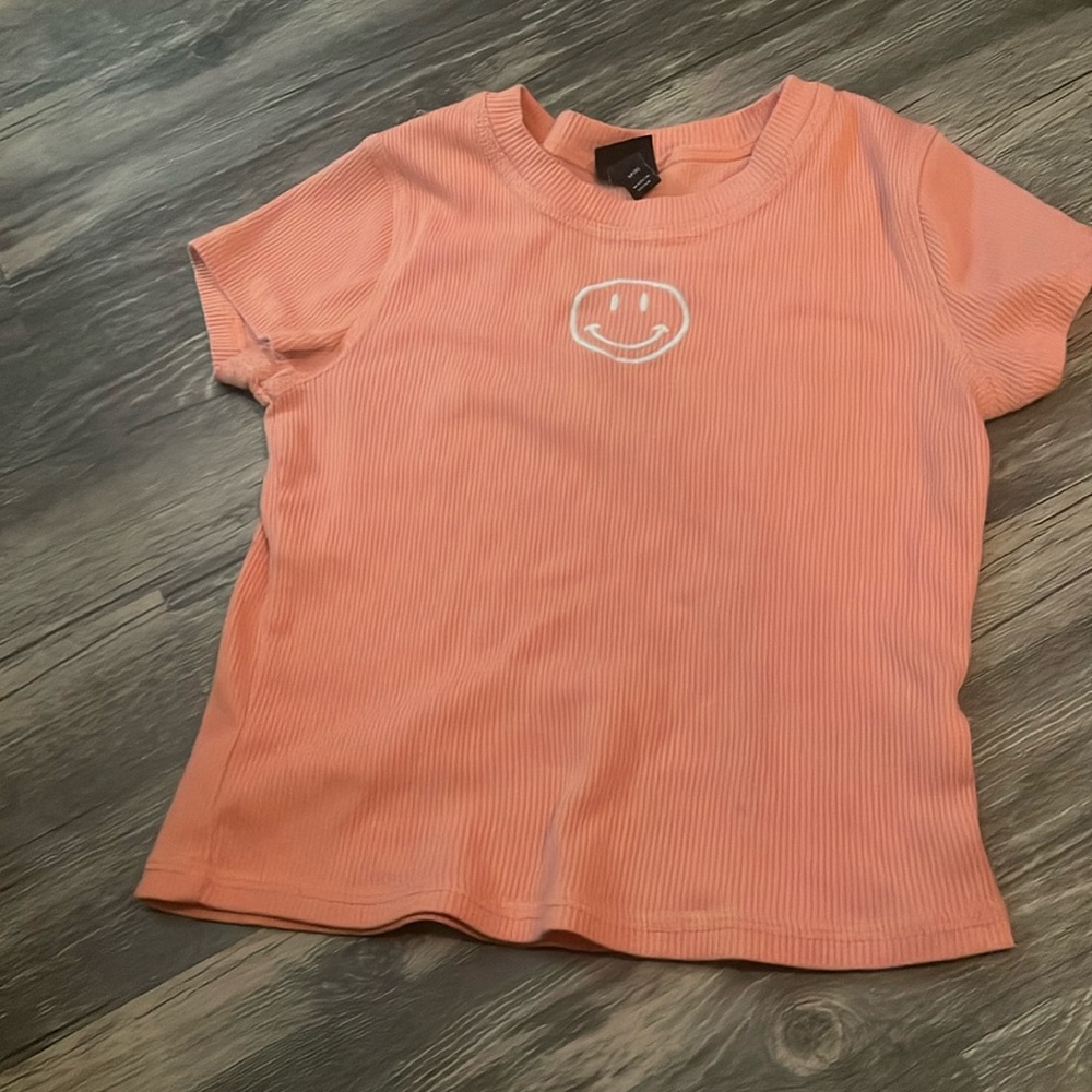 Orange smiley face shirt